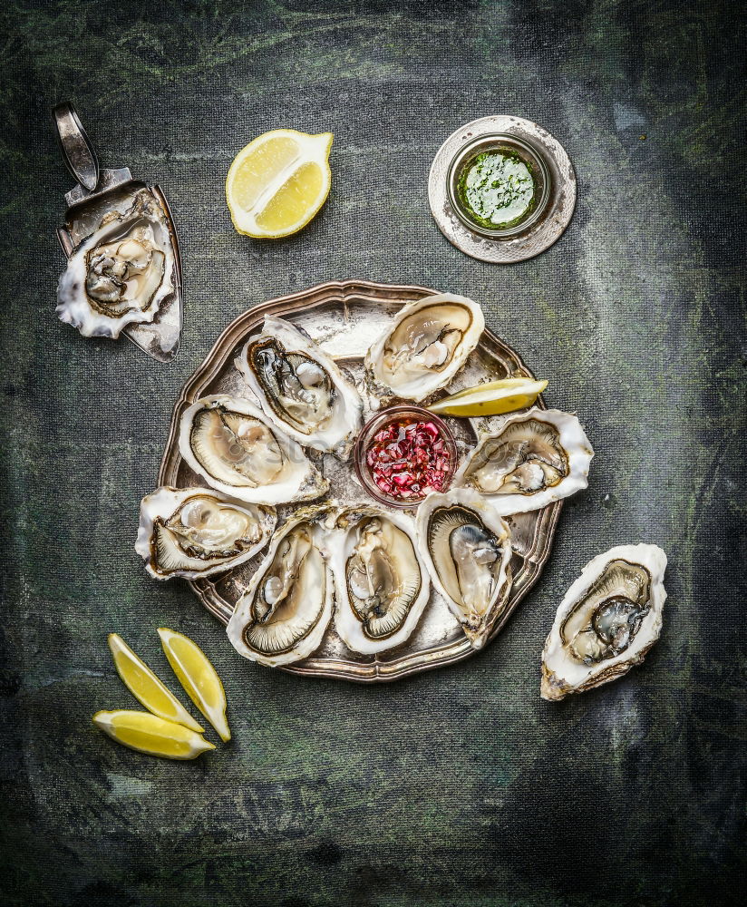 Oyster platter with lemon and various sauces