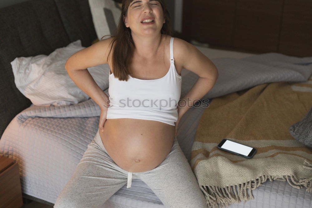 Similar – Young woman with long brunette hair and long legs sits on bed in panties