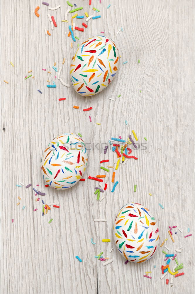 Similar – Image, Stock Photo Number 3 laid out of small chocolate candies with colored sugar sprinkles on white background