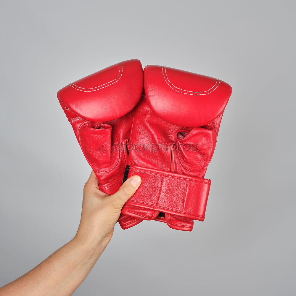 Similar – Image, Stock Photo red leather boxing gloves, a plastic water bottle