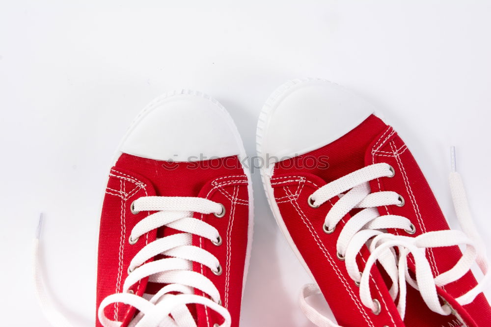 Image, Stock Photo Red shoes and red boxing gloves hanging on a rope