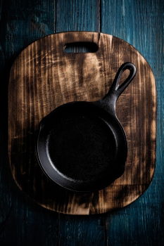 Similar – Black cast-iron frying pan on a brown wooden surface