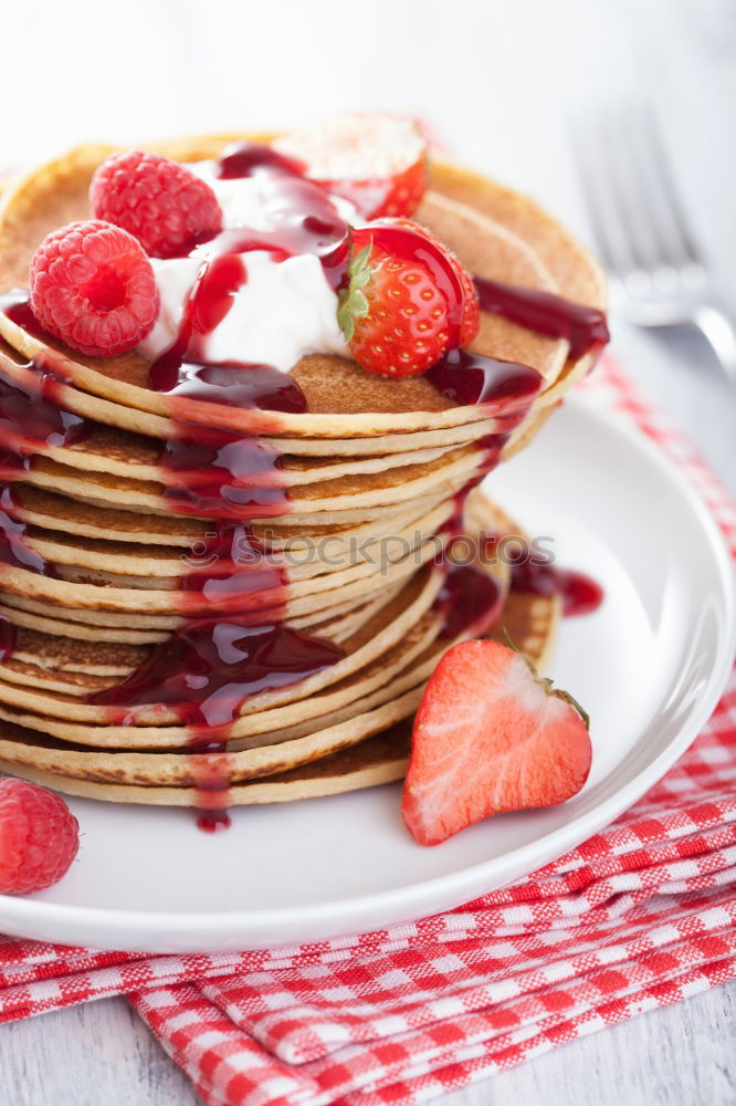 Similar – Pancakes with raspberries and blueberries