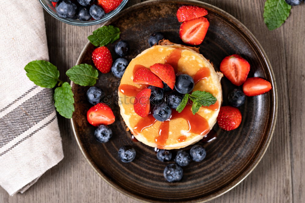 Similar – Fresh yogurt with fruits and muesli on breakfast