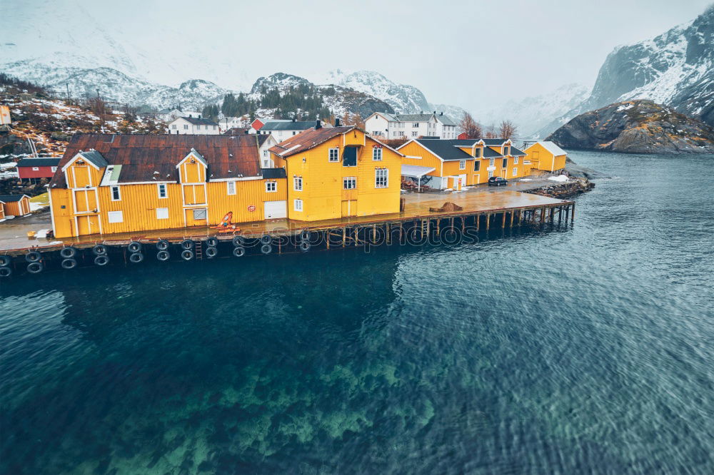 Similar – Small houses on lakeside in mountains