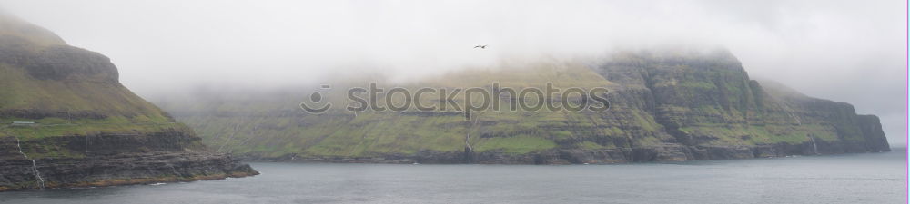 Similar – Rainy atmosphere at the southernmost point of Lofoten with view