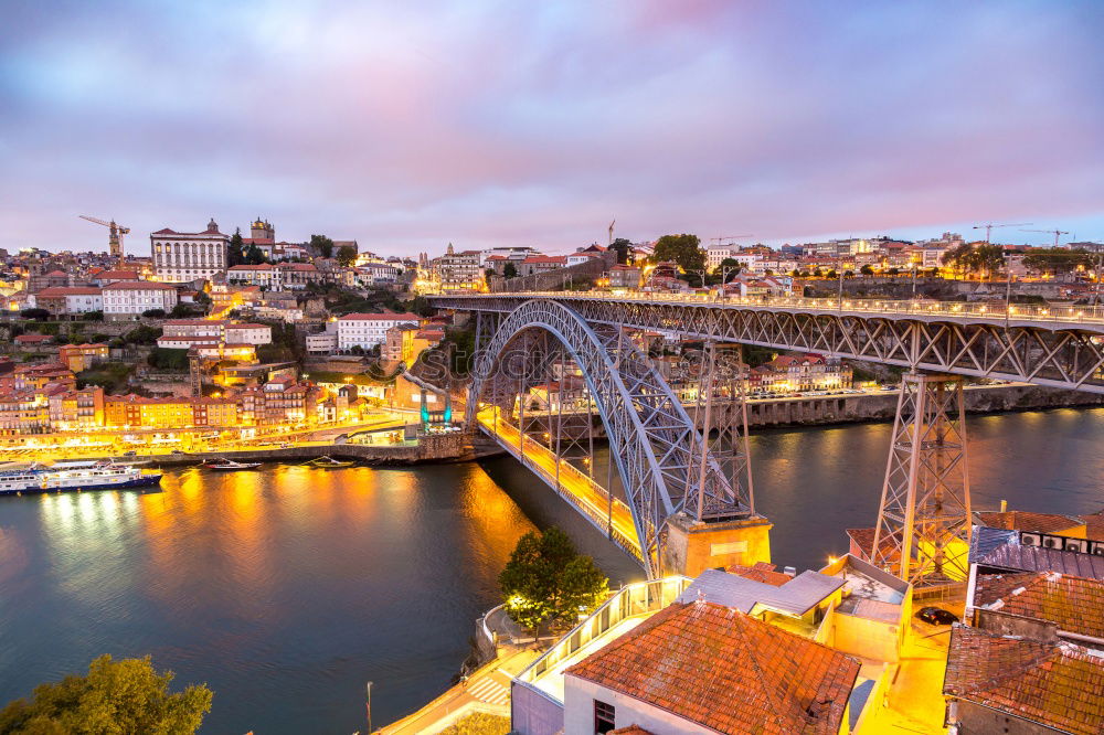 Skyline of the historic city of Porto with famous bridge at night, Portugal