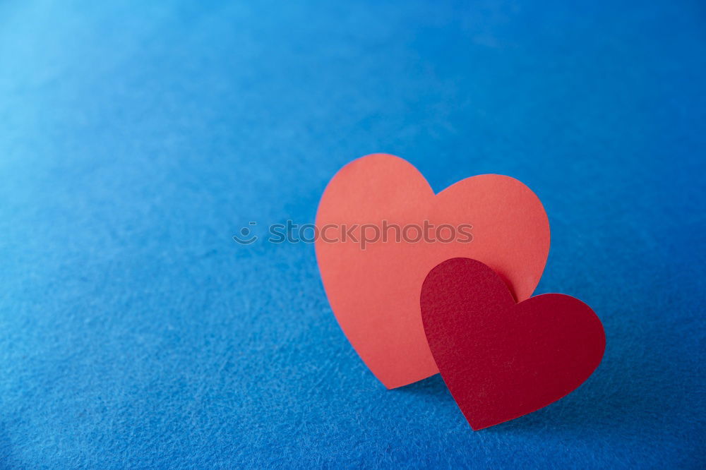 Similar – jeans and two red wooden hearts