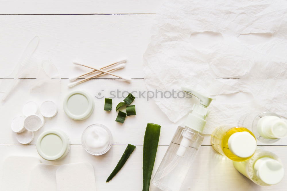 Green spa background with cloth, candle and orchid