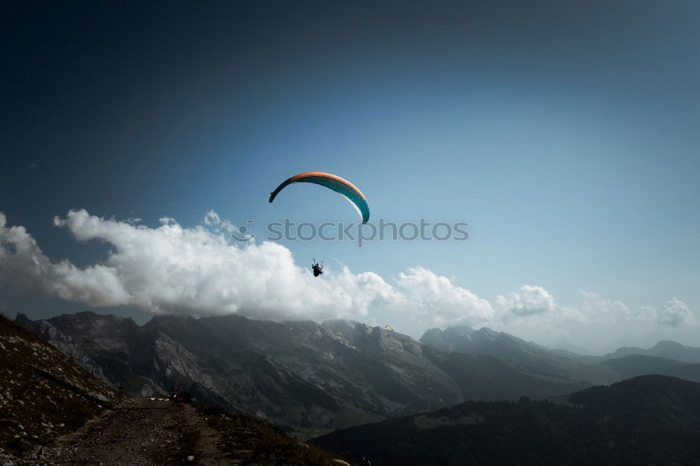 Similar – Paraglider takes off in a dreamlike evening atmosphere