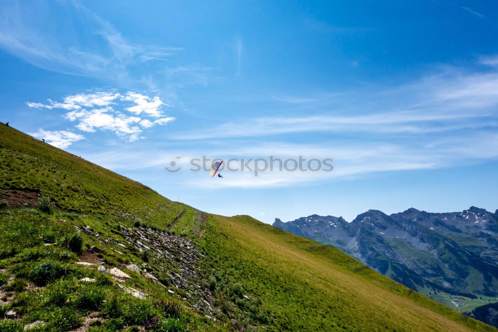 Similar – Team of climbers reaching the summit.