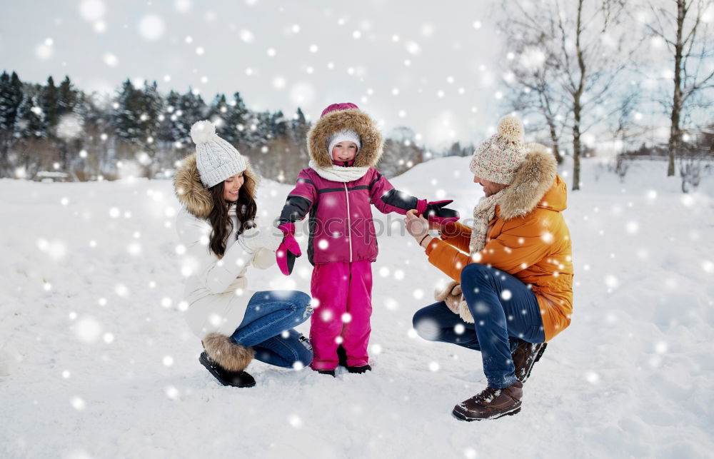 Similar – Image, Stock Photo Family spending time together outdoors in the winter. Parents with children gathered around the campfire preparing marshmallows and snacks to toasting over the campfire using wooden sticks