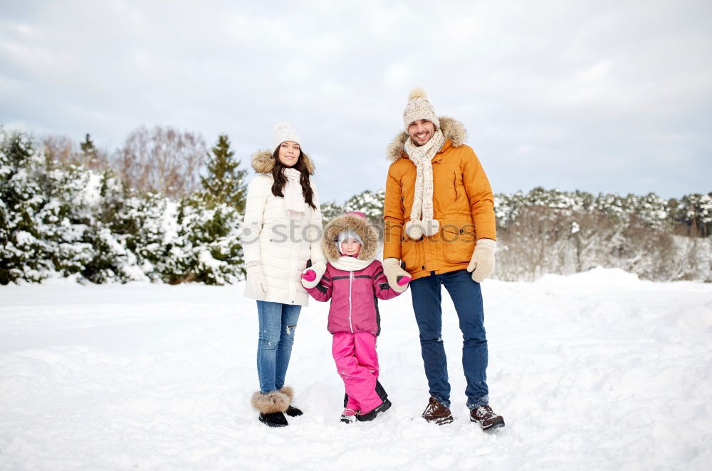 Similar – Teenage girl pulling sled with her little sister through forest