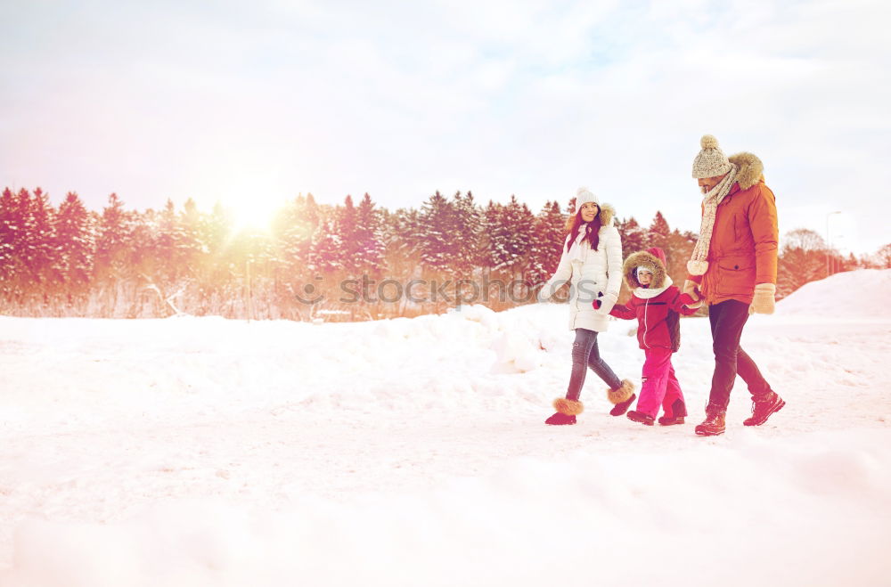 Similar – Friends playing snowballs in woods