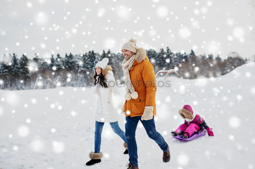 Similar – Teenage girl pulling sled with her little sister through forest