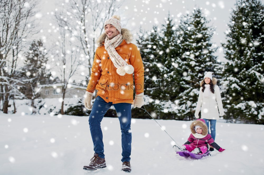 Similar – Teenage girl pulling sled with her little sister through forest