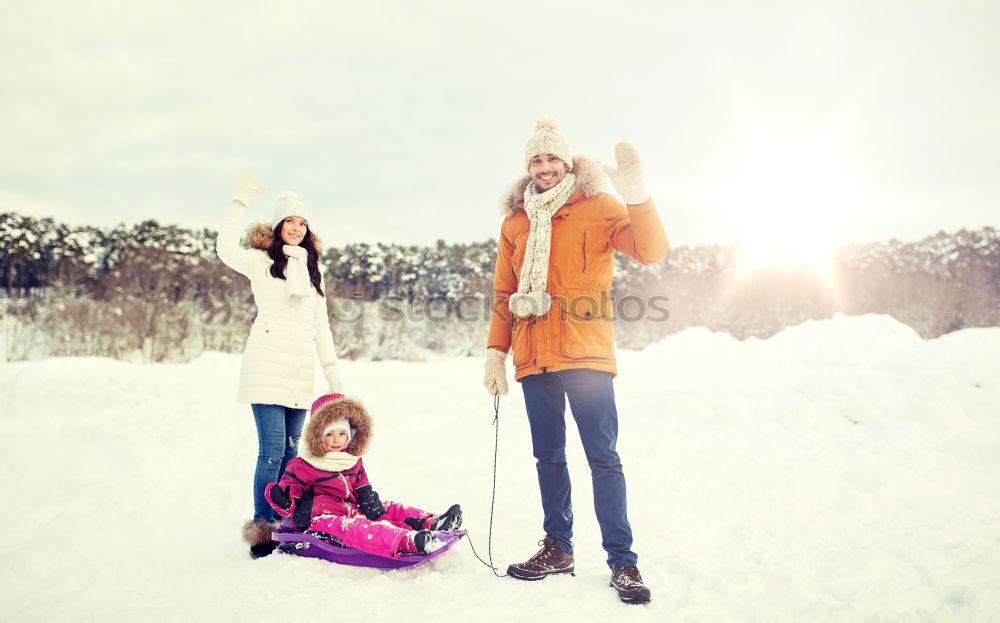 Similar – Teenage girl pulling sled with her little sister through forest