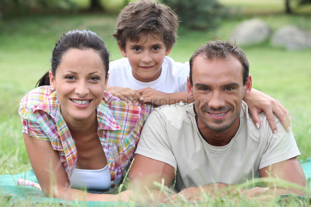 Similar – Happy family in a urban park playing with tablet computer