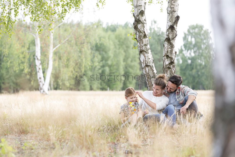 Image, Stock Photo Lesbian family with child on lawn
