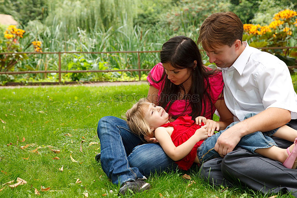 Similar – Happy family in a urban park playing with tablet computer