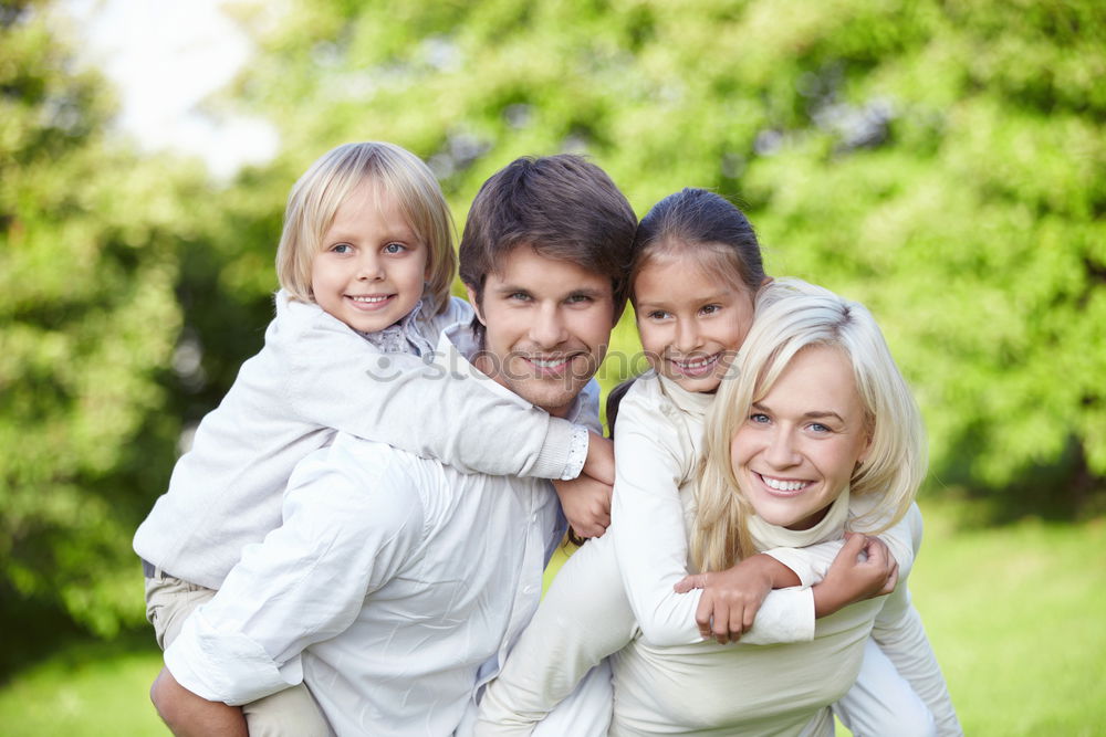 Similar – Image, Stock Photo Happy young family in a urban park.