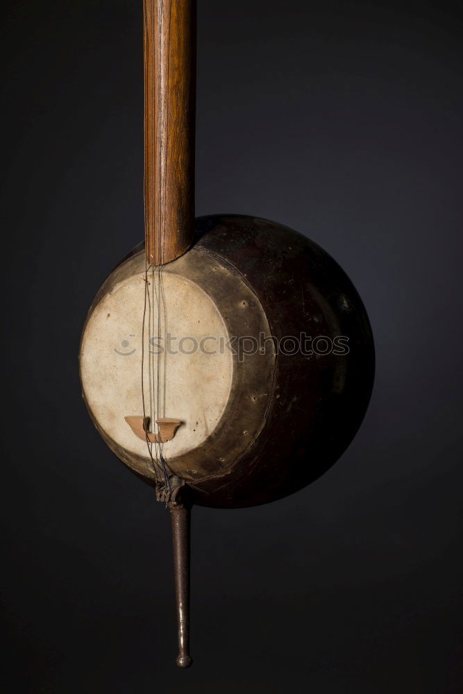 Similar – three historical yarn spindles made of wood with different yarns