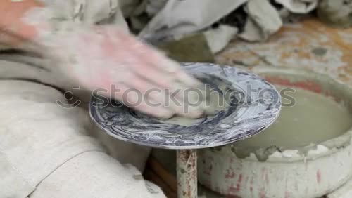 Similar – Image, Stock Photo Potter’s hands making a pot in a traditional style.