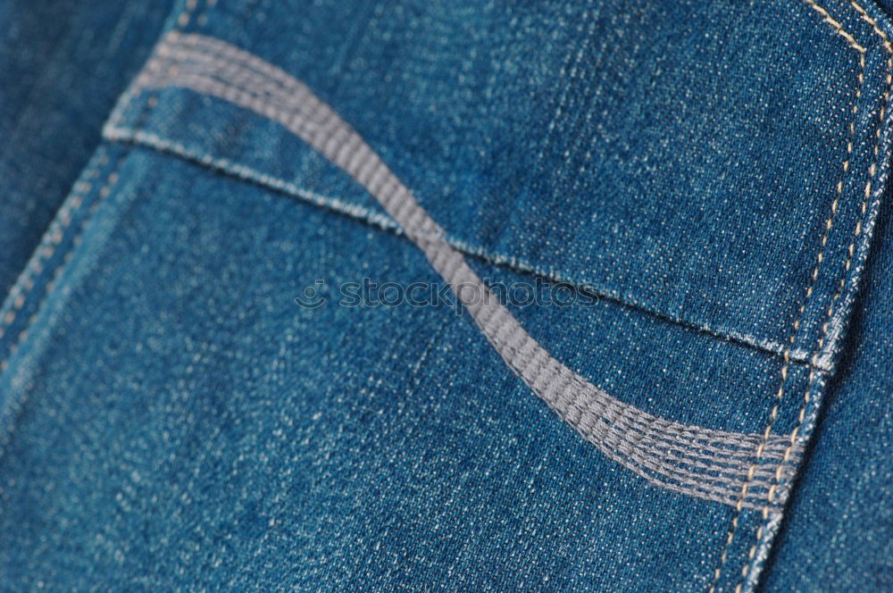 Similar – Textur-Tasche einer blauen, zerknitterten Jeans Makro-Nahaufnahme