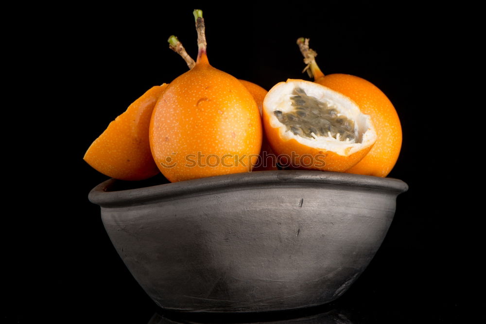 Similar – Oranges on dark background