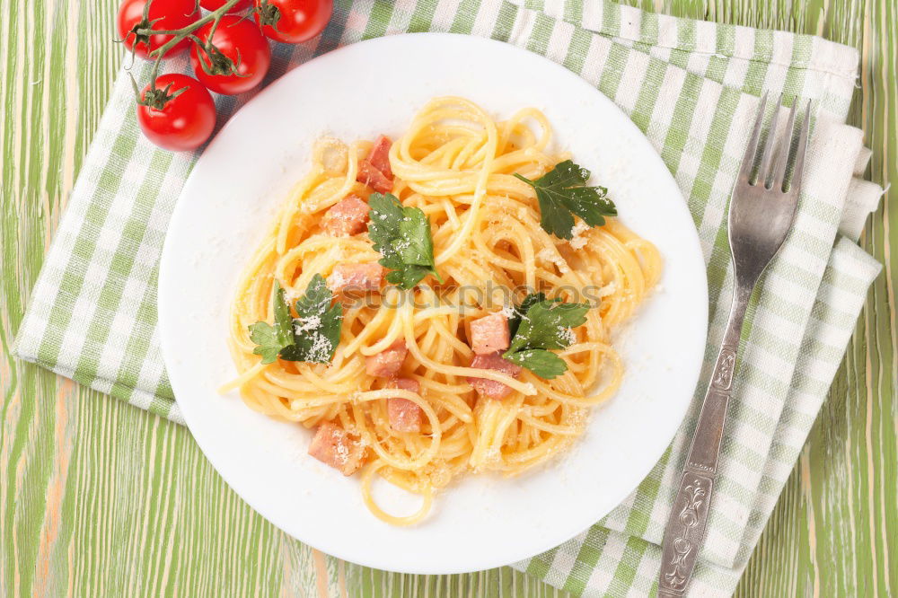 Similar – Spaghetti Carbonara in a green plate