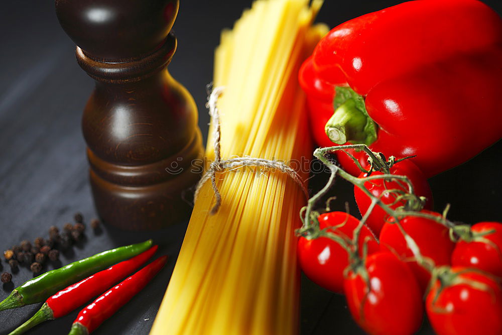 Similar – Image, Stock Photo cutting board with a knife and fresh red cherry tomatoes