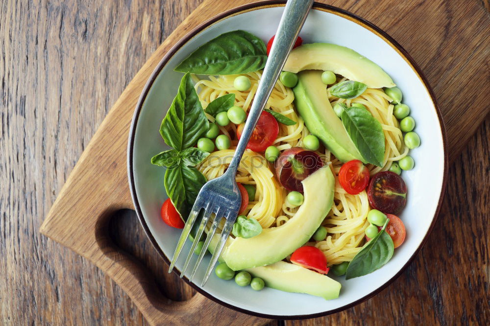 Similar – Vegan Buddha bowl with fresh raw vegetables and quinoa on wood