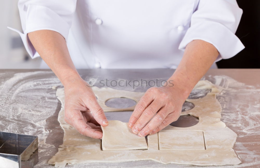 Similar – woman kneading bread dough with her hands