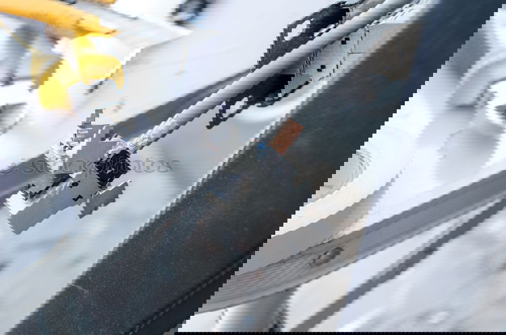 Similar – Image, Stock Photo Mechanic fixing custom motorcycle wheel