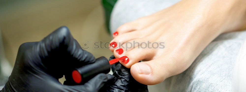 Similar – Close-up shot of a ballerina taking off the ballet shoes sitting on the floor in the studio