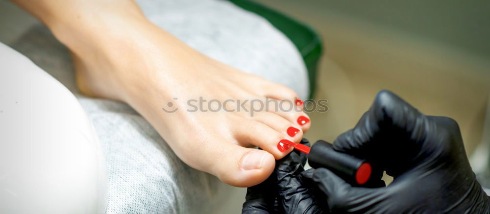 Similar – Close-up shot of a ballerina taking off the ballet shoes sitting on the floor in the studio