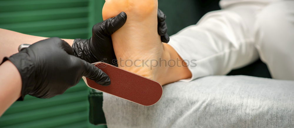 Similar – Close-up shot of a ballerina taking off the ballet shoes sitting on the floor in the studio