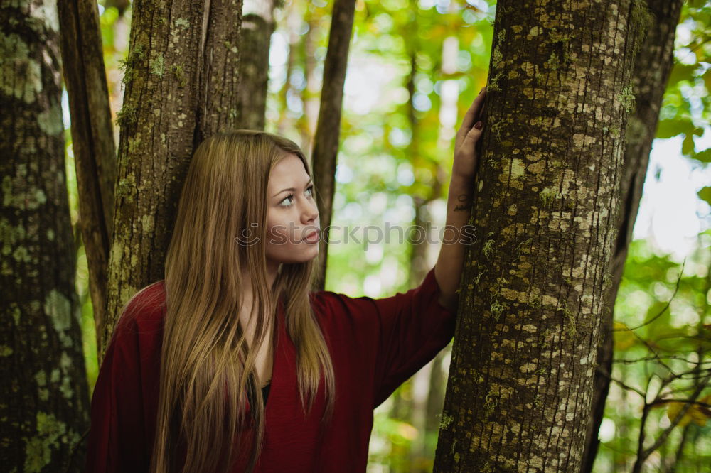 Similar – Portrait of a young slender woman in the forest