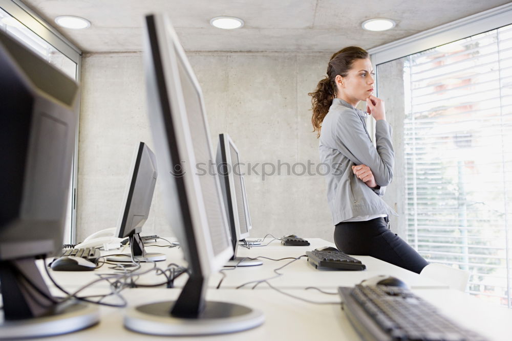 Similar – Concentrated young lady using laptop and sitting at table