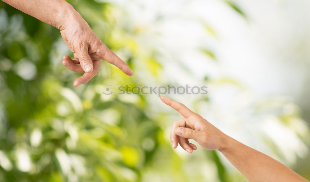 Similar – Child and senior man hands giving five in the nature