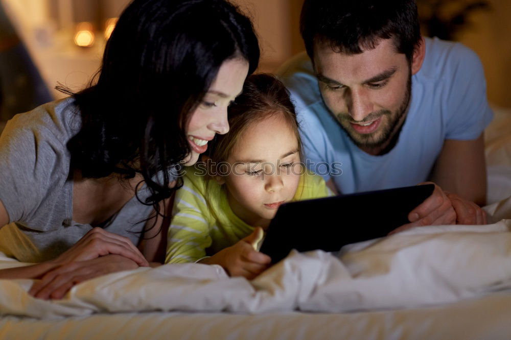 Similar – Mother and her child with digital tablet.