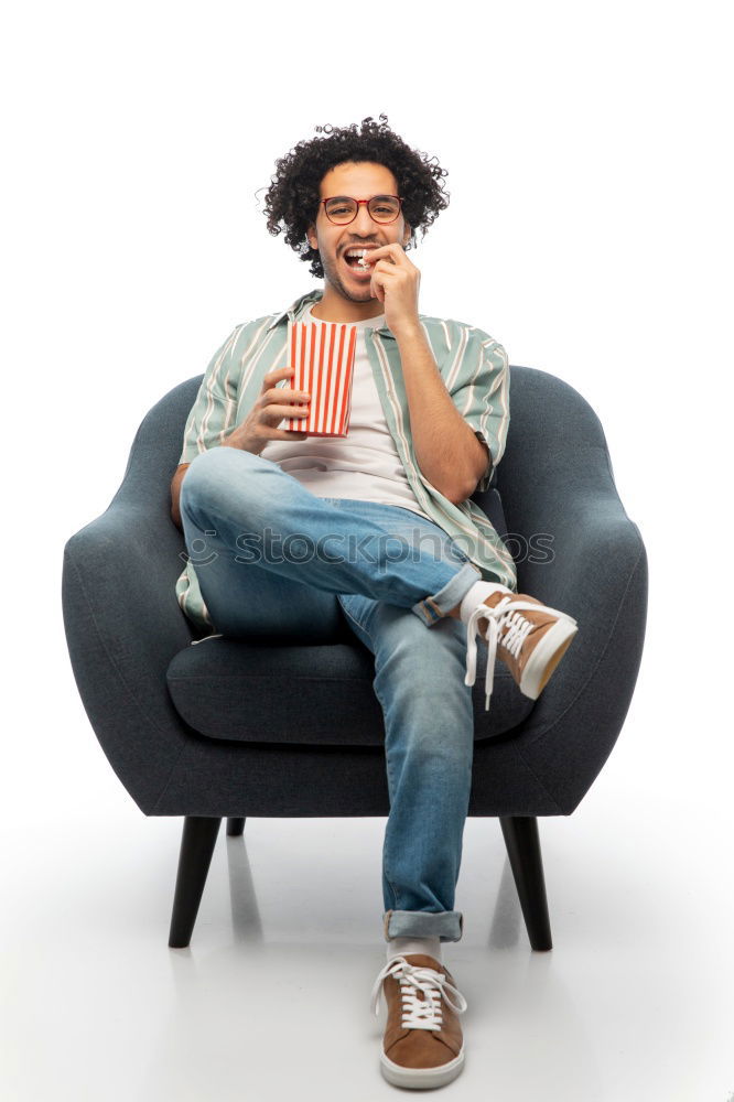 Similar – Portrait of a young thoughtful mixed race man sitting in the sofa