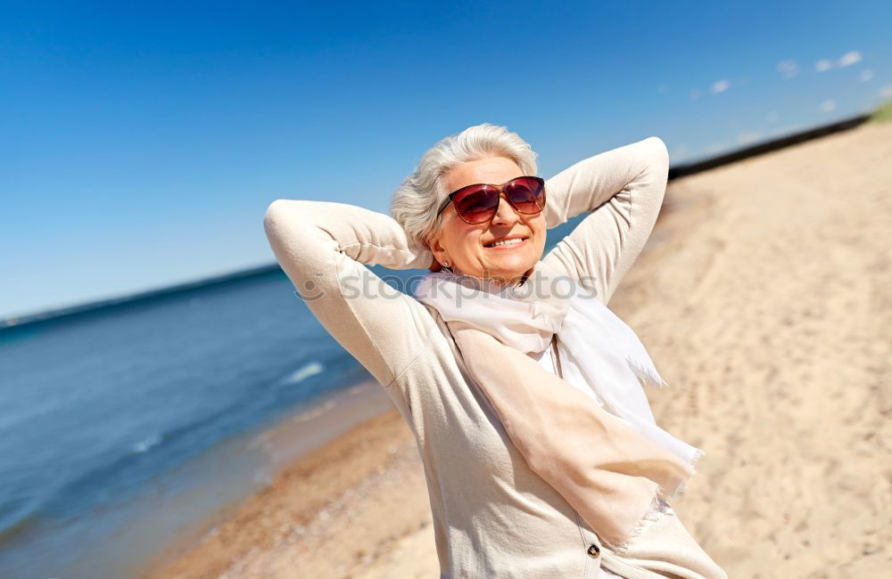 Similar – Senior old woman grey hair sitting by the swimming pool