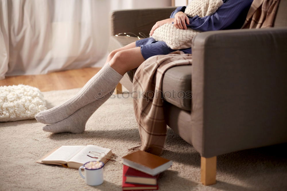 Similar – mother reading book to toddler daughter