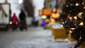 Similar – Kitschy, bizarre, decorated Christmas tree stands between wires, church, lamp and lantern in the city and lights up. Funny, abstract, bright, funny, urban Christmas mood with Christmas tree & light outside in front of blue sky in Advent