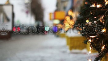 Similar – Kitschy, bizarre, decorated Christmas tree stands between wires, church, lamp and lantern in the city and lights up. Funny, abstract, bright, funny, urban Christmas mood with Christmas tree & light outside in front of blue sky in Advent