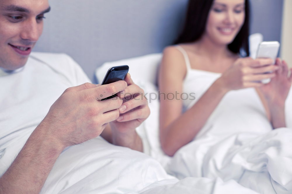 Image, Stock Photo Couple browsing on online on smartphone at home