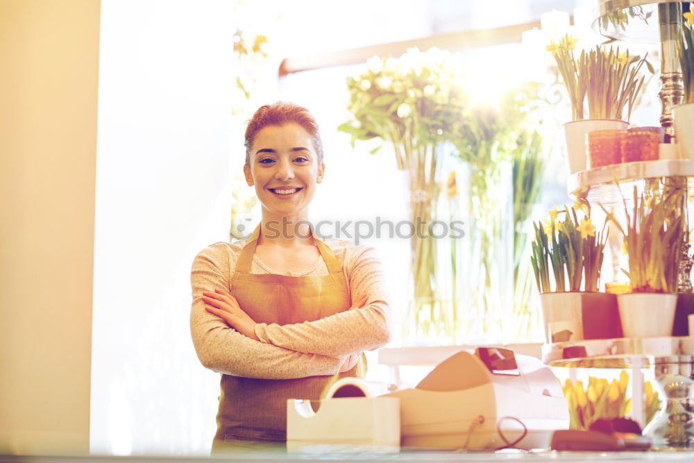 Similar – Attractive young woman paying in a shop