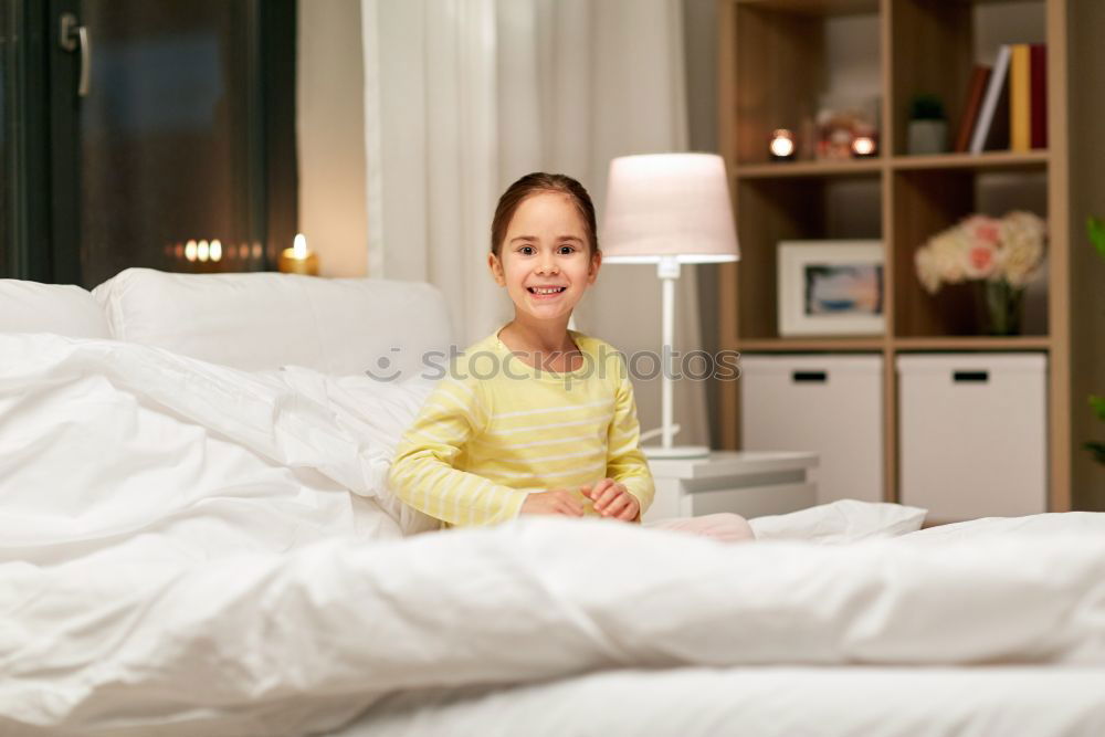 Similar – happy kid girl waking up in early morning