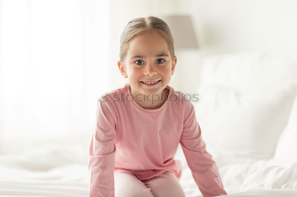 Similar – cute happy child girl relaxing at home on the bed